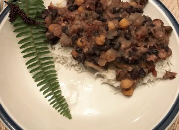 sweet and sour beans on rice on a plate