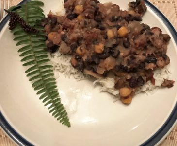 sweet and sour beans on rice on a plate