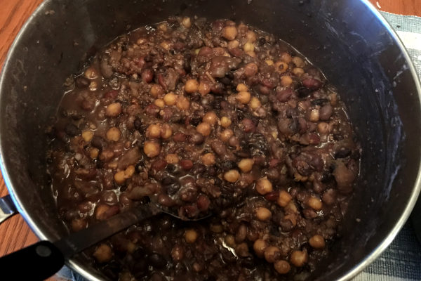 sweet and sour beans in a dutch oven pot