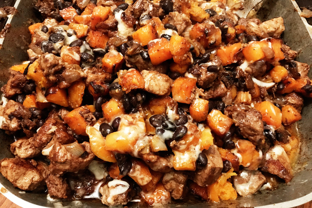 Filling of Cuban burritos in a skillet
