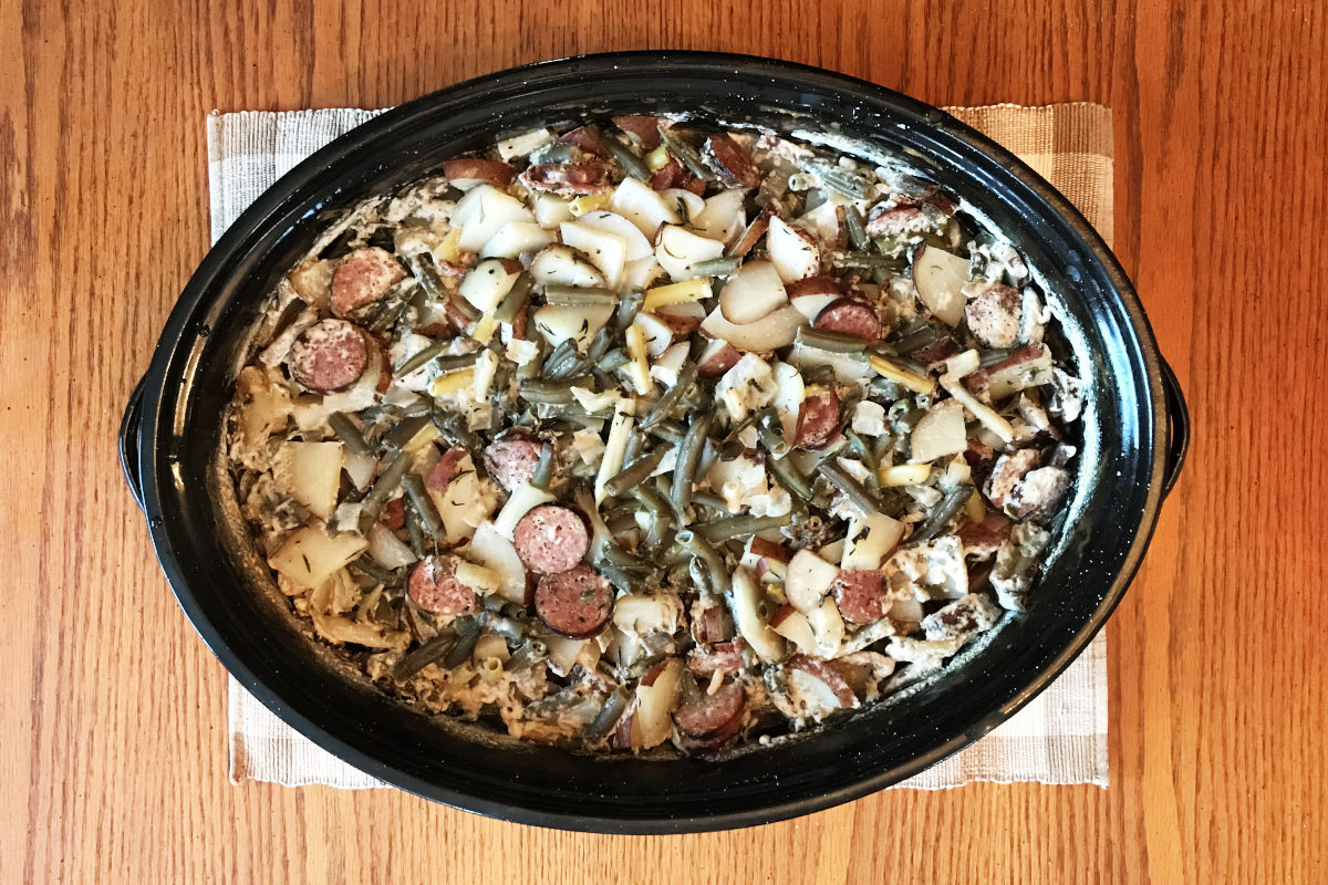 green bean glory baked in a black enamel casserole dish