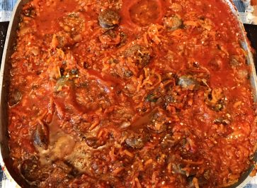 spaghetti sauce with Italian sausage in skillet