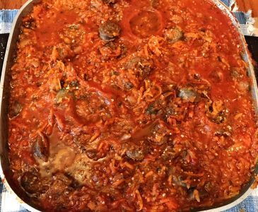spaghetti sauce with Italian sausage in skillet