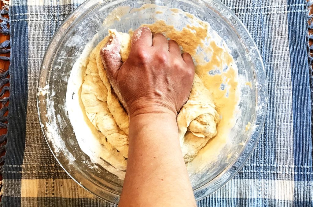 kneading dough in the mixing bowl