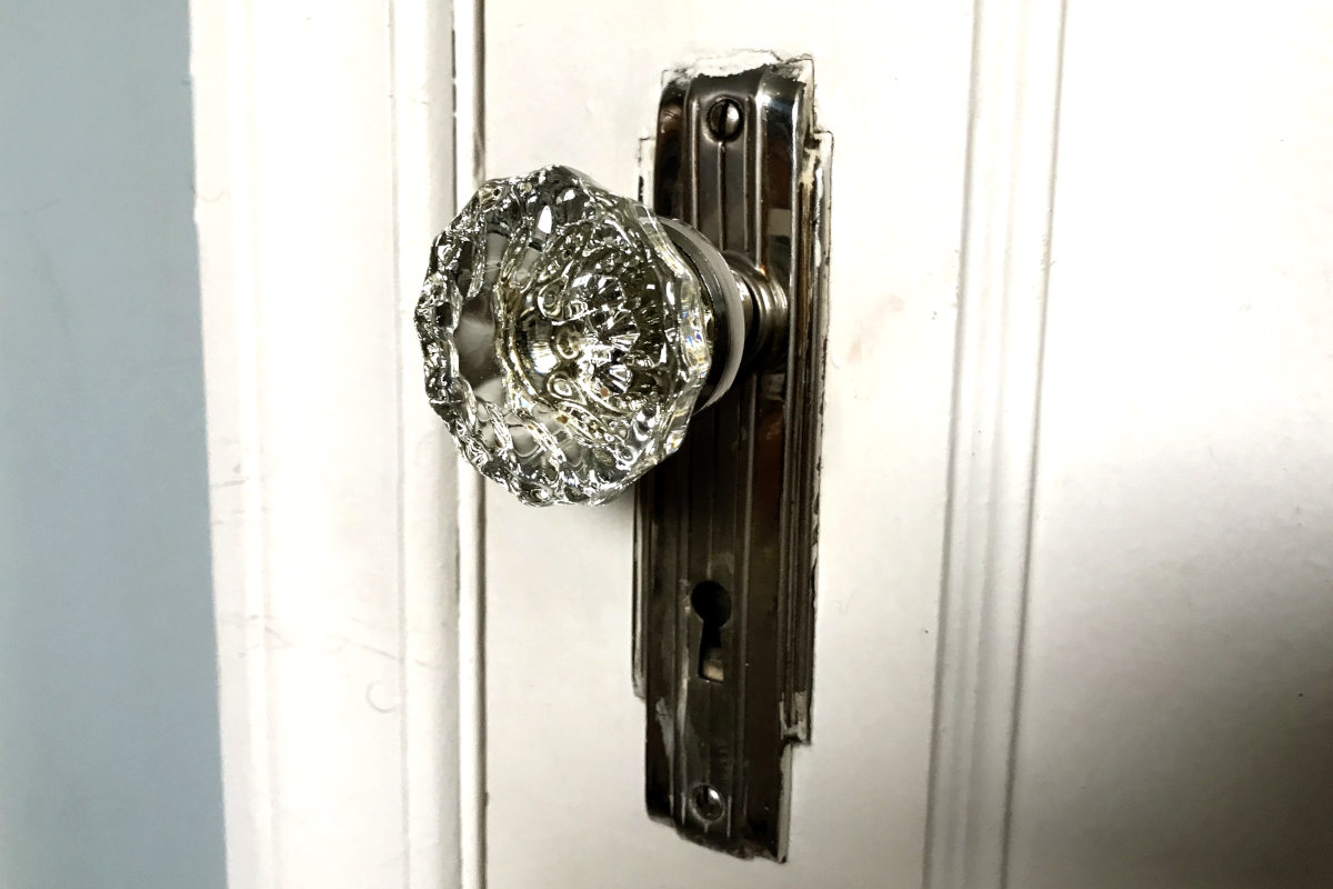 glass doorknob on white door