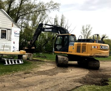excavator begins digging the basement for our old house remodel