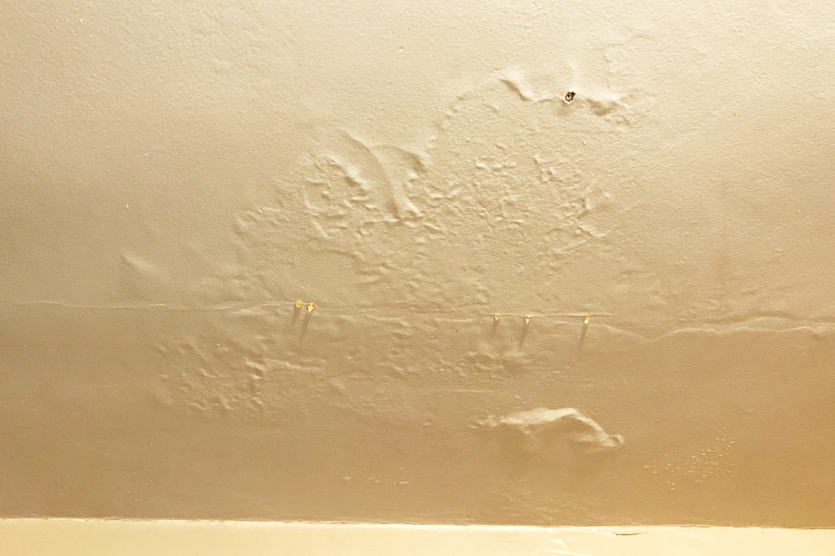 bubbles in ceiling from water damage in old house remodel