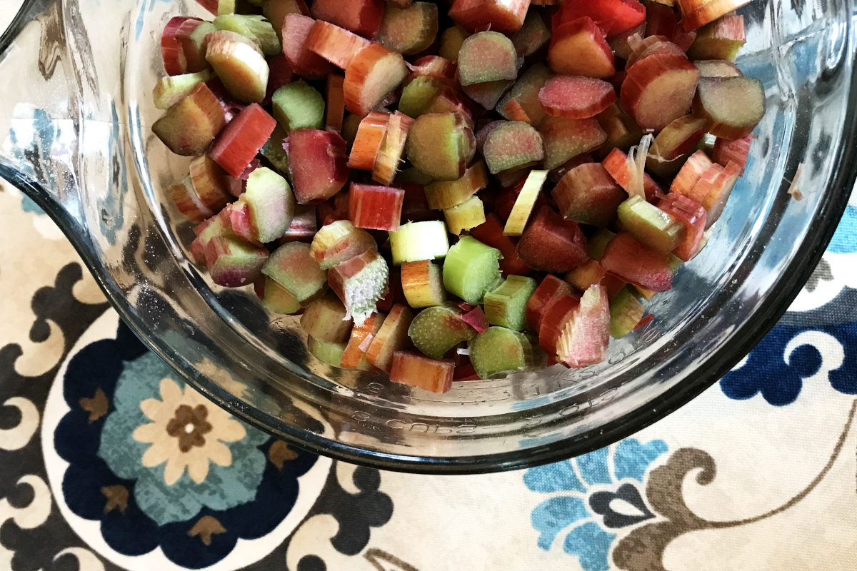 close up of bowl with chopped rhubarb for rhubarb dessert