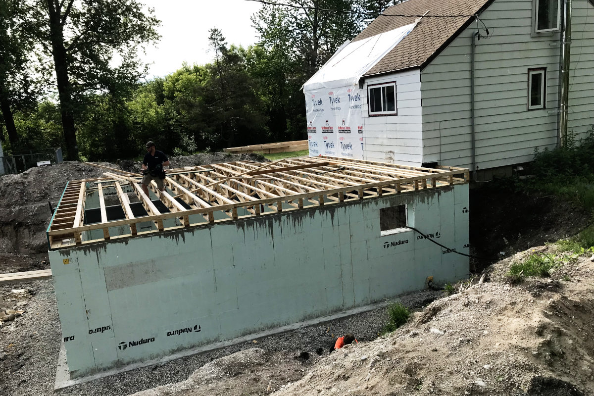view from the side and above of floor joists installed for old house remodel