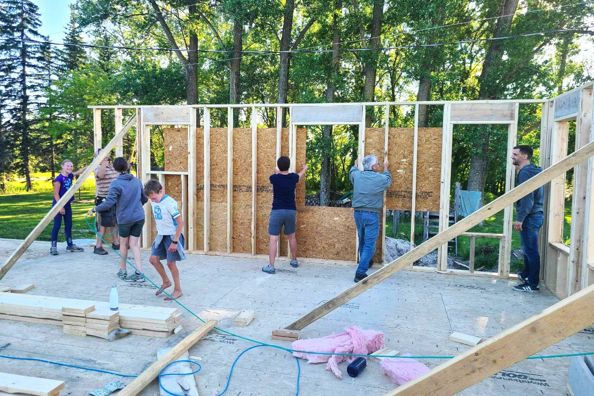 Raising of the west wall in the old house remodel.