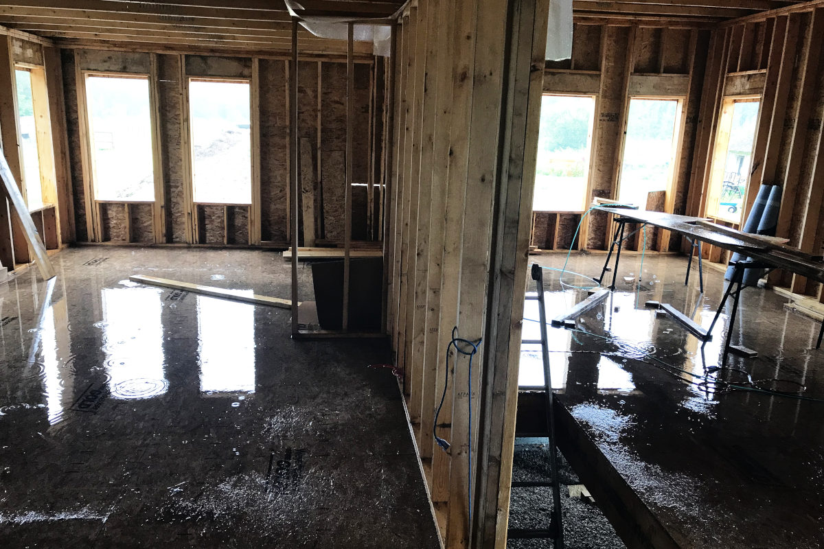 water leaking into large puddles in the addition of our old house remodel