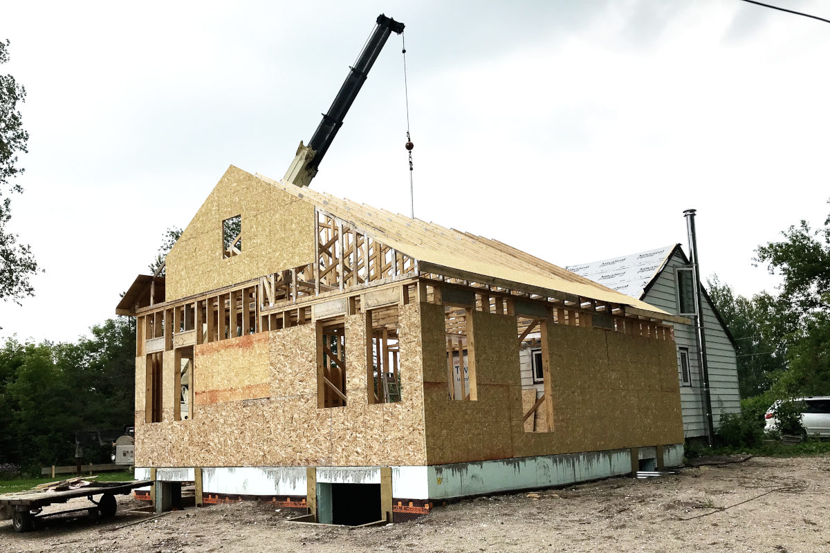 setting trusses on the roof with a crane