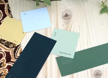 paint swatches for old house remodel on pine with deep red and gold fabric