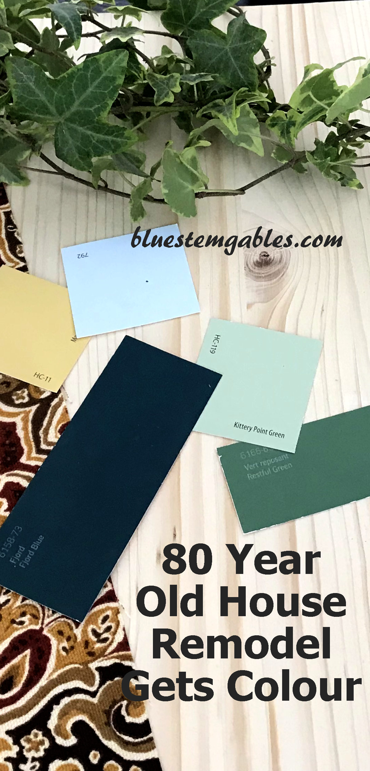 paint swatches on pine with deep red and gold fabric and an ivy plant