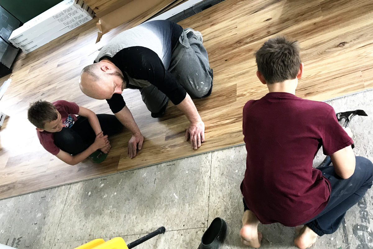 installing luxury vinyl plank flooring in our old house remodel addition