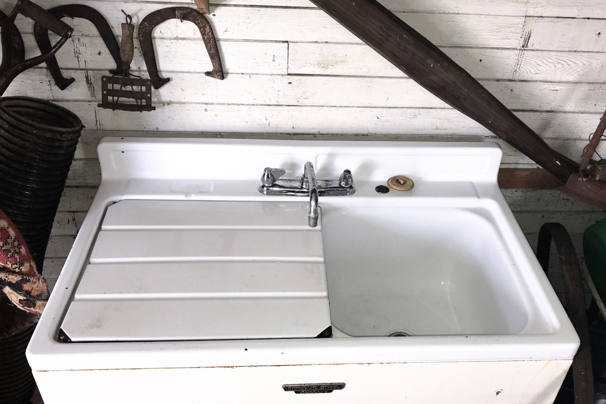 Old enamel sink with drain board