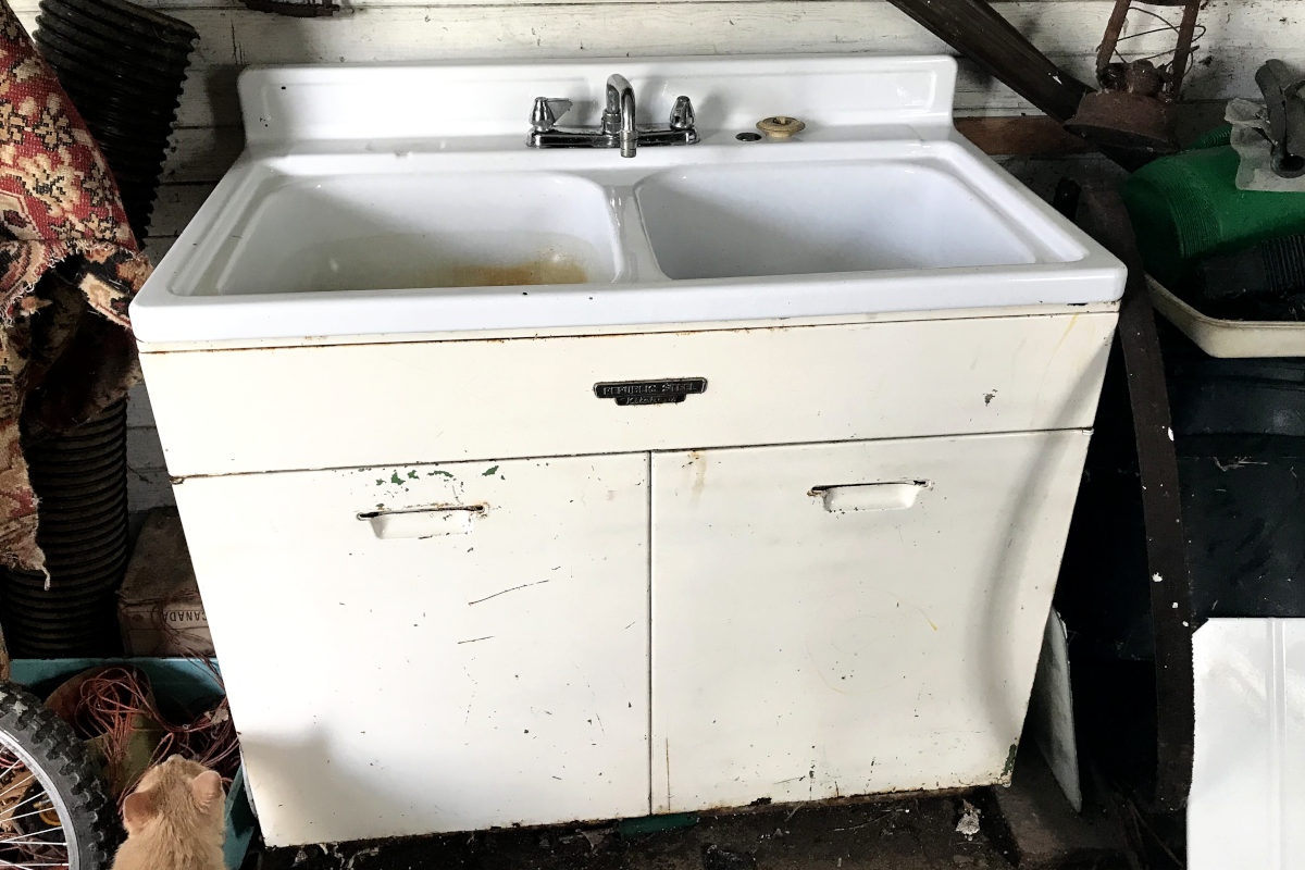 old enamel double farmhouse sink in the old summer kitchen