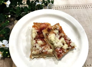two pieces of platz on a plate with a flowering plant