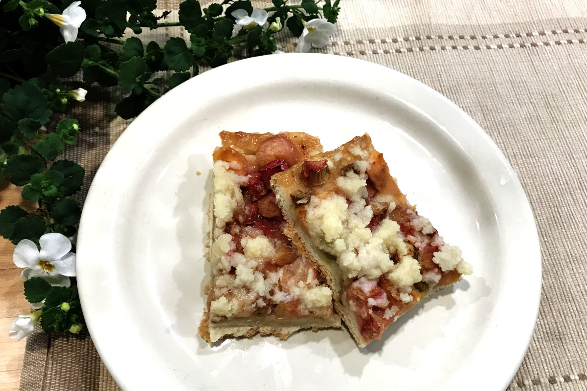 two pieces of platz on a plate with a flowering plant