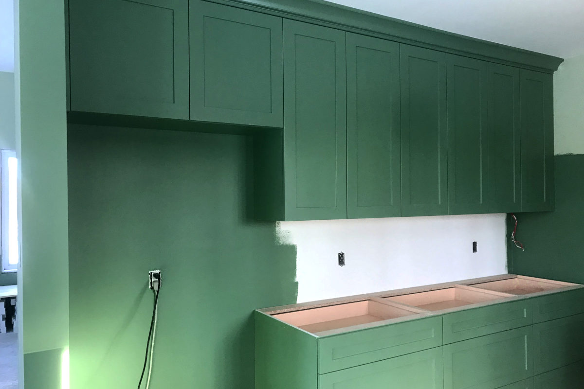 wall of green cabinets