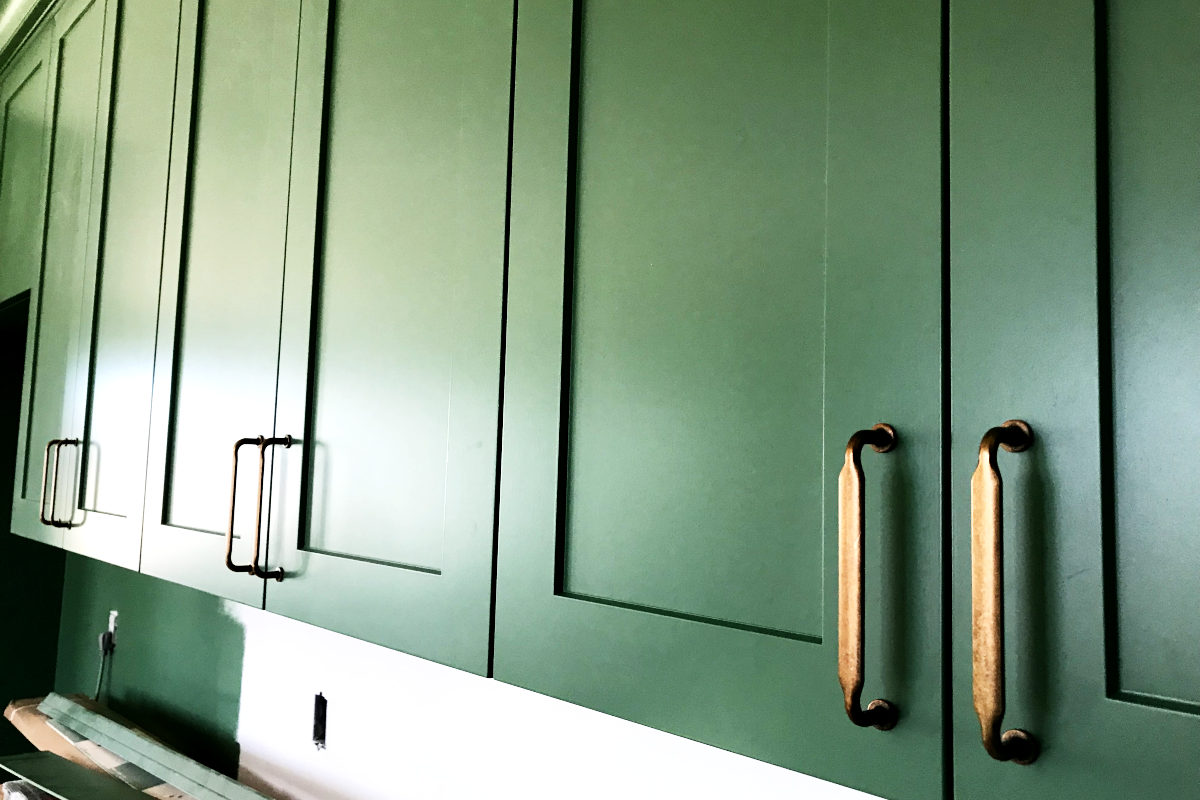 upper cabinets and old brass looking pulls